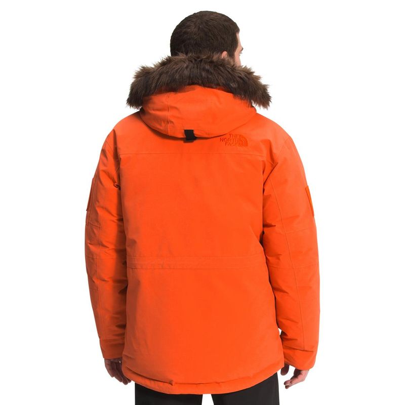 orange parka with fur hood